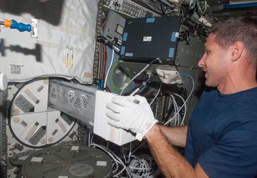nasa2explore 10424187763 Astronaut Mike Hopkins With Station Freezer