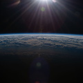 nasa2explore_50810376133_An_orbital_sunrise_above_the_North_Pacific.jpg