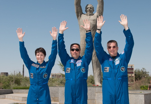 12-15-05 In front of the statue of Yuri Gagarin, the first human in space, in the town of Baikonur, Kazakhstan, Expedition 40 41 backup crewmembers Samantha Cristoforetti of the European Space Agency (left), Ant o