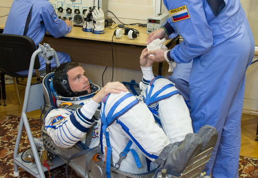 12-41-29 At the Baikonur Cosmodrome in Kazakhstan, Expedition 40 41 Flight Engineer Reid Wiseman of NASA undergoes leak and pressure checks on his Russian Sokol launch and entry suit May 16 during a dress rehear o