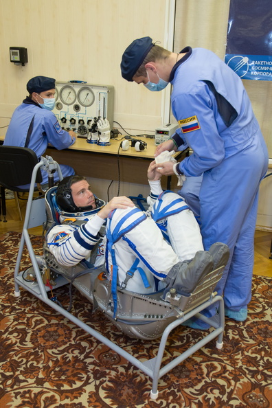 12-41-29_At the Baikonur Cosmodrome in Kazakhstan, Expedition 40_41 Flight Engineer Reid Wiseman of NASA undergoes leak and pressure checks on his Russian Sokol launch and entry suit May 16 during a dress rehear_o.jpg