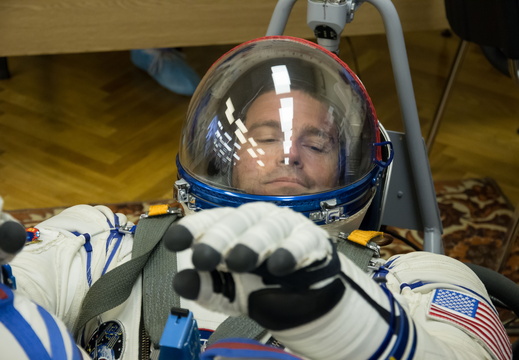 12-43-55 At the Baikonur Cosmodrome in Kazakhstan, Expedition 40 41 Flight Engineer Reid Wiseman of NASA undergoes leak and pressure checks on his Russian Sokol launch and entry suit May 16 during a dress rehear o