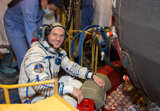 13-17-28-3 At the Baikonur Cosmodrome in Kazakhstan, Expedition 40 41 Flight Engineer Alexander Gerst of the European Space Agency poses for a picture May 16 in his Russian Sokol launch and entry suit as he ente o
