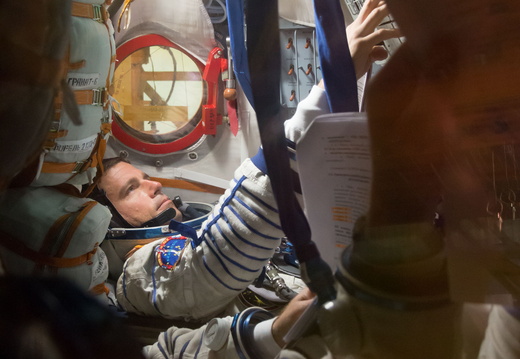 13-52-01-3 At the Baikonur Cosmodrome in Kazakhstan, Expedition 40 41 Flight Engineer Reid Wiseman of NASA participates in a dress rehearsal “fit check” May 16 inside the Soyuz TMA-13M spacecraft. Wiseman, Soyuz o