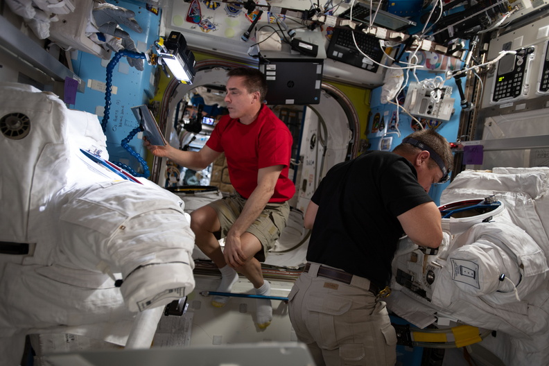 astronauts-chris-cassidy-and-bob-behnken-work-on-us-spacesuit-maintenance_50044213648_o.jpg