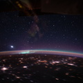 an-aurora-accents-earths-atmospheric-glow-underneath-a-starry-sky_49676279953_o.jpg