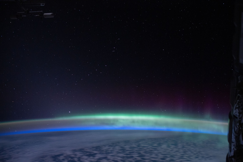 the-earths-glow-mingles-with-the-aurora-australis_49778146688_o.jpg