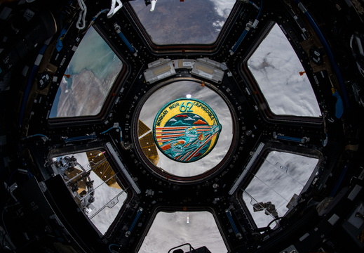 the-expedition-62-mission-patch-floats-inside-the-seven-window-cupola 49596884056 o