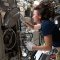 nasa2explore_51232424495_Astronaut_Megan_McArthur_swaps_sample_cartridges_in_a_research_rack.jpg